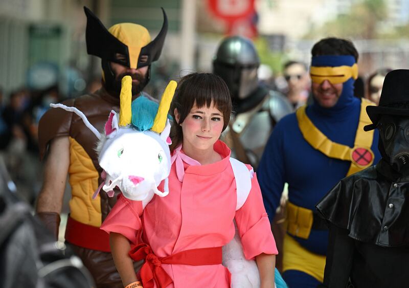 A cosplayer dressed as Chihiro Ogino from 'Spirited Away'. AFP