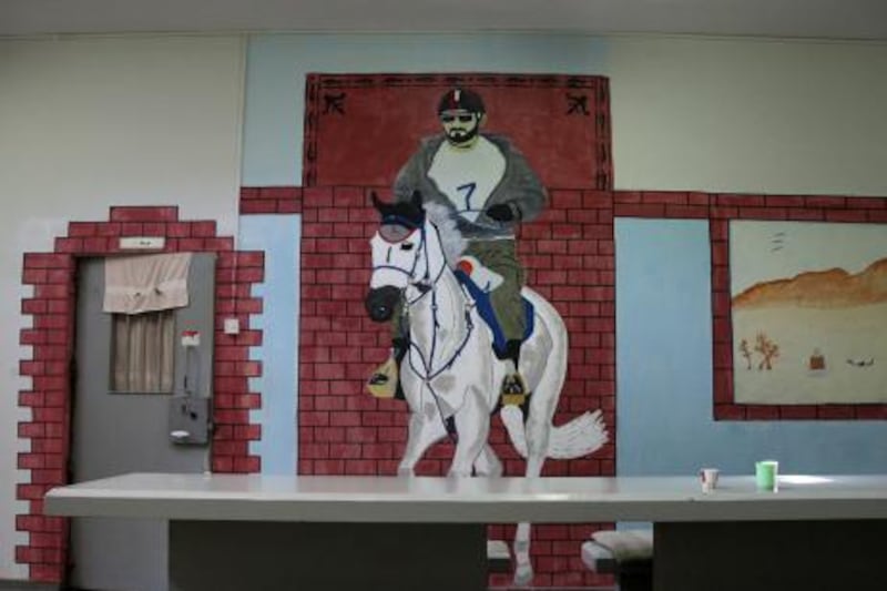 Ras Al Khaimah - November 16 2011 - A dining area of the Ras Al Khaimah Central Prison is painted with an iconic mural of Sheikh Mohammad Bin Rashid on a horse. The murals are part of the rehabilitation and reform program for prisoners. Colonel Sultan Al Jarwan, head of the Rehabilitation and Reform section oversees several learning and arts-based workshops on a day-to-day basis. (Razan Alzayani/ The National) 