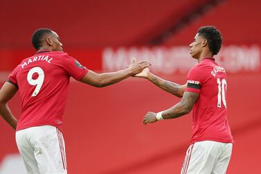 Soccer Football - Premier League - Manchester United v Southampton - Old Trafford, Manchester, Britain - July 13, 2020 Manchester United's Marcus Rashford scores their first goal with Anthony Martial, as play resumes behind closed doors following the outbreak of the coronavirus disease (COVID-19) Pool via REUTERS/Dave Thompson EDITORIAL USE ONLY. No use with unauthorized audio, video, data, fixture lists, club/league logos or 'live' services. Online in-match use limited to 75 images, no video emulation. No use in betting, games or single club/league/player publications. Please contact your account representative for further details.