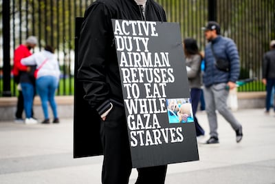 Larry Hebert's placard highlights the lack of food available in Gaza amid the war with Israel. Joshua Longmore / The National
