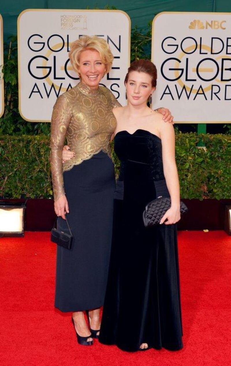 Emma Thompson, left, and Gaia Romilly Wise arrive at the 71st annual Golden Globe Awards at the Beverly Hilton Hotel in Beverly Hills. John Shearer/Invision/AP
