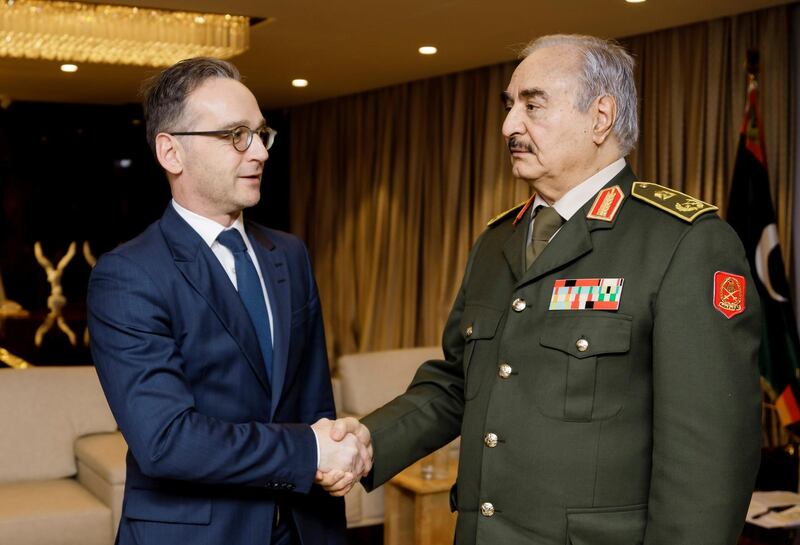 German Foreign Minister Heiko Maas shakes hands with Libya's commander Khalifa Haftar, in Benghazi, Libya, January 16, 2020, in this handout photo provided by the German Foreign Ministry. Auswaertiges Amt/Xander Heinl/photothek.de/Handout via REUTERS ATTENTION EDITORS - THIS IMAGE WAS PROVIDED BY A THIRD PARTY. NO RESALES. NO ARCHIVES.