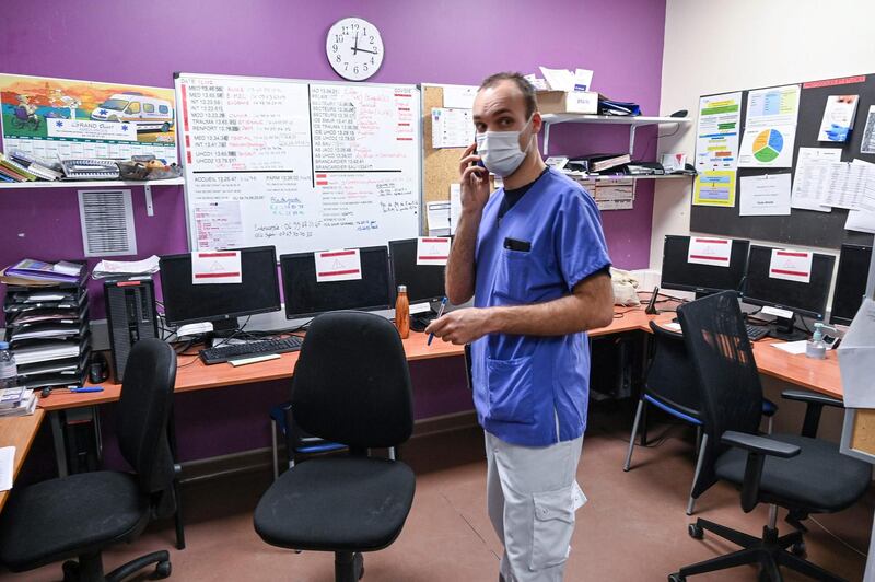 A nurse tries to work as all computers are rendered out of service following a cyber attack at the Villefranche-sur-Saone's hospital in France. AFP