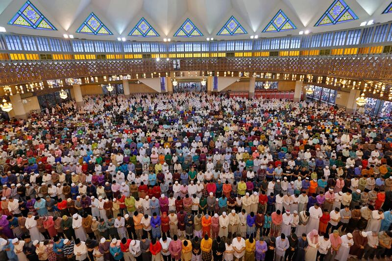 Muslims offer prayers in Kuala Lumpur, Malaysia. Vincent Thian / AP Photo