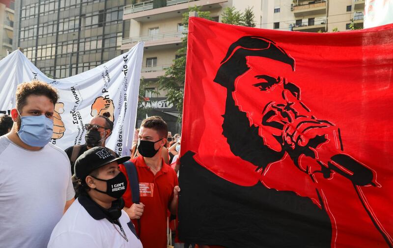 A banner depicting Greek rapper Pavlos Fyssas is seen as demonstrators protest ahead of the trial. Reuters