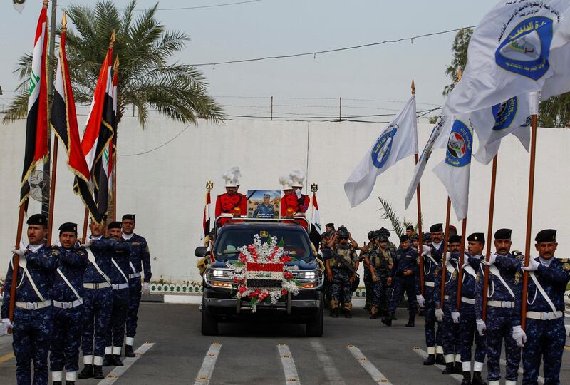 A vehicle transports a mock coffin of Major General Ali al-Lami, who commands the Iraqi Federal Police's Fourth Division, who was killed in the Zor area north of Samara in Salahuddin, during a symbolic funeral ceremony in Baghdad, Iraq. Reuters