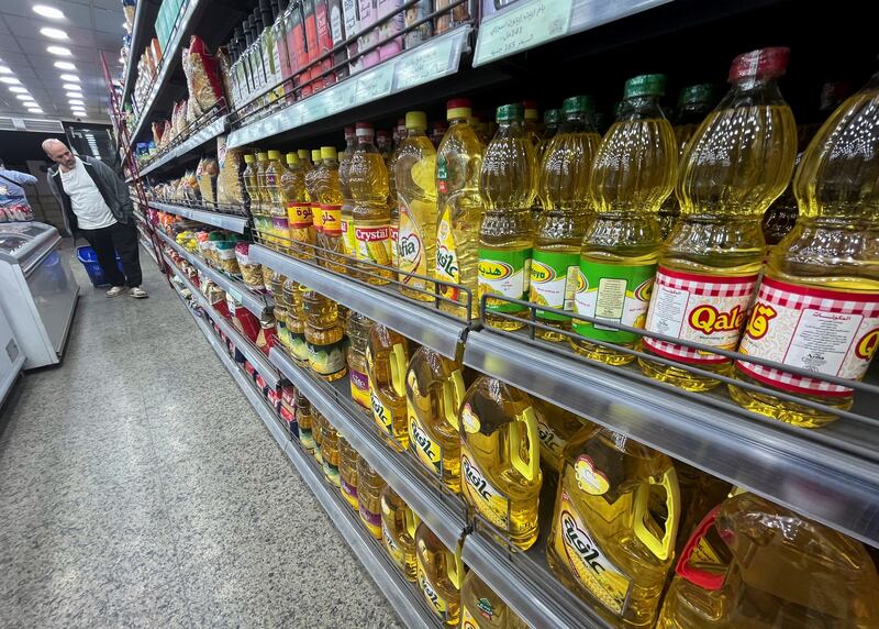 A man looks at shelves holding food items in a Cairo supermarket. Reuters