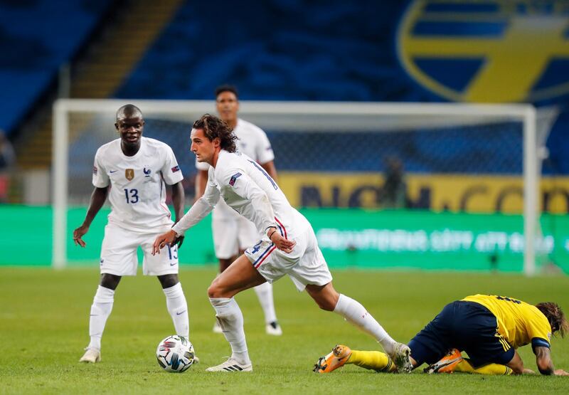 France's Adrien Rabiot runs with the ball. EPA