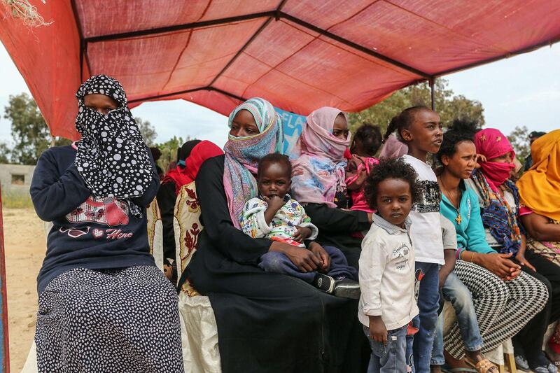 Migrants wait for Antonio Guterres's arrival to Ain Zara detention centre for migrants in Tripoli, Libya. AFP