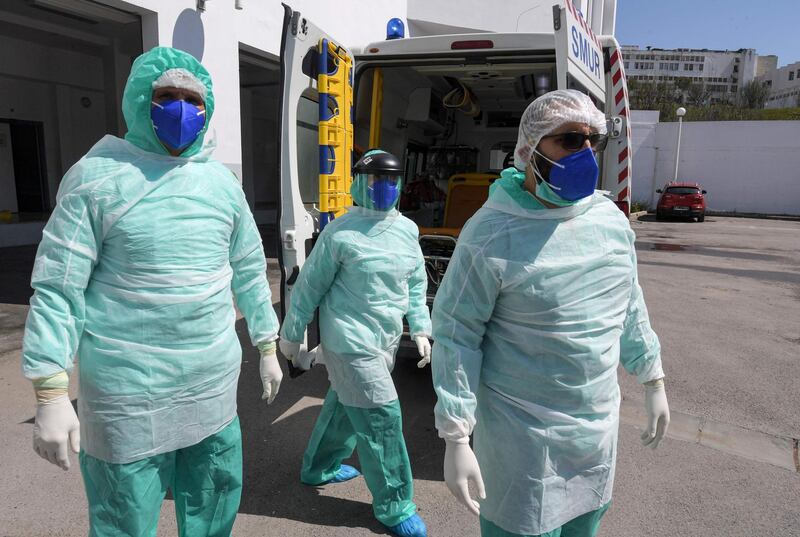 Medical and paramedical staff of SAMU Tunisia dressed in personal protective equipment (PPE) head out to visit a coronavirus patient in the capital Tunis. AFP