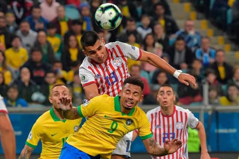 Brazil's Jesus and Paraguay's Junior Alonso vie for the ball. AFP