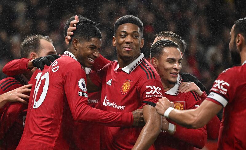 Marcus Rashford (L) celebrates with teammates after scoring the first goal in the 3-0 Premier League win against Nottingham Forest at Old Trafford on December 27, 2022. AFP