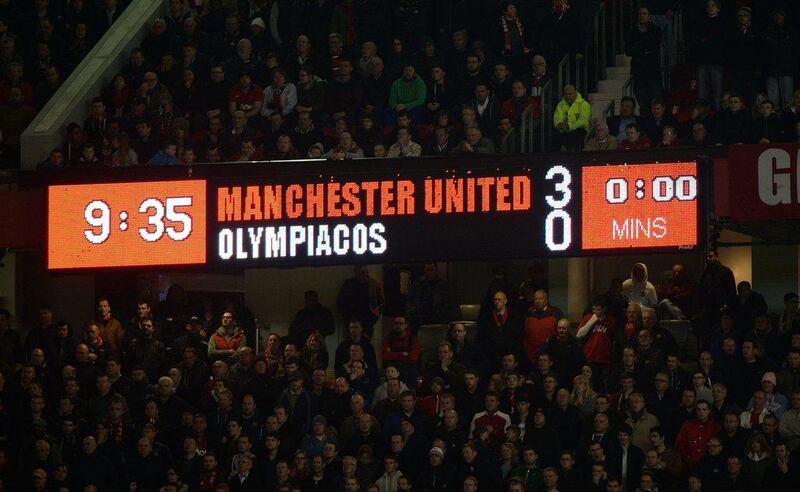 A view of the scoreboard in the east stand inside Old Trafford at the final whistle of Wednesday night's Manchester United v Olympiakos match. Peter Powell / EPA / March 19, 2014