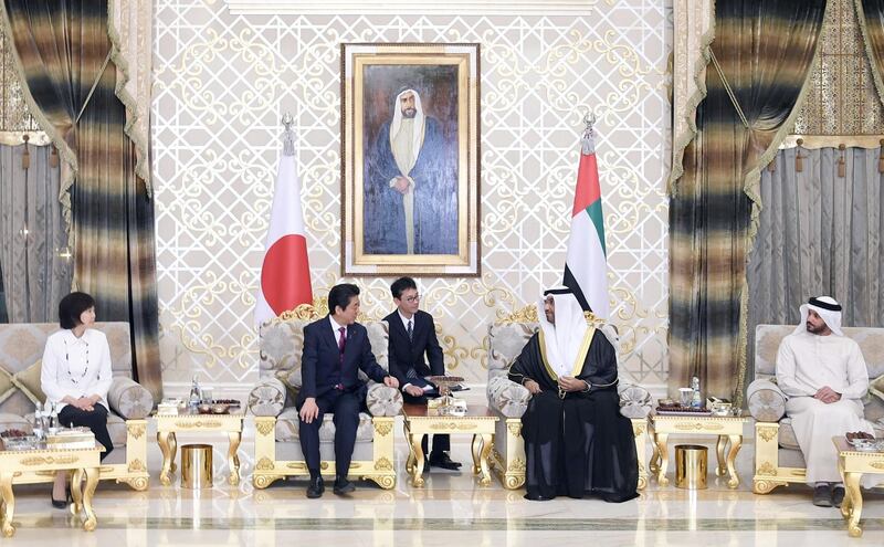 Japanese PM Shinzo Abe (second left) talks with Dr Sultan Al Jaber (second right), upon his arrival to visit Abu Dhabi on first leg of his Middle East tour. EPA / WAM