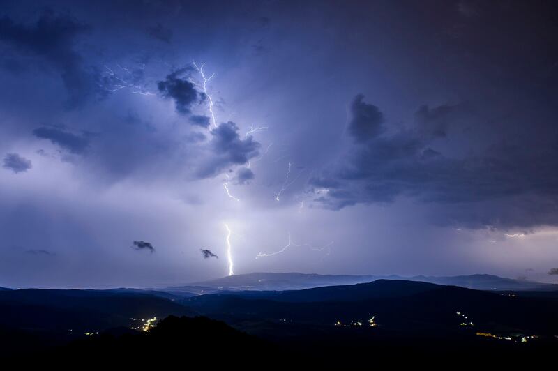 Lightning strikes from dark clouds during a storm near Salgotarjan, Hungary.  EPA / Peter Komka