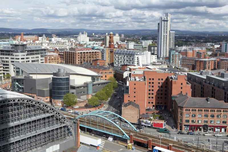 Elevated view of the skyline of Manchester with the 'Gmex' convention centre in foreground