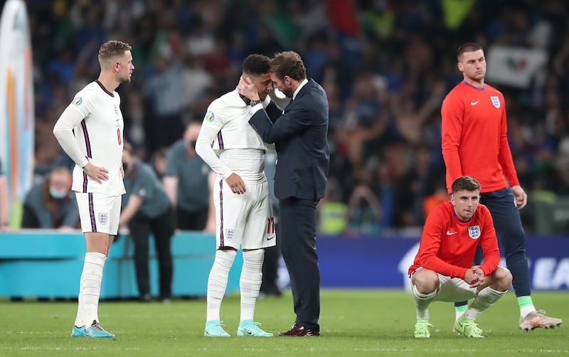 England manager Gareth Southgate consoles Jadon Sancho following defeat at Wembley.