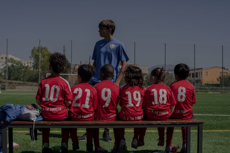 Young players of La Torreta Football Club's "escuela" team (ages 4-5), wait for their turn to play. Photo: Hannah Cauhepe for The National