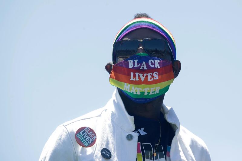 Erik Webb wears a rainbow face mask during the coronavirus outbreak in San Francisco, California this week. AP Photo
