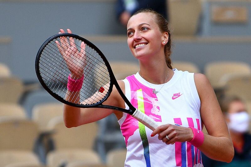 TOPSHOT - Czech Republic's Petra Kvitova celebrates after winning against Germany's Laura Siegemund at the end of their women's singles quarter-final tennis match on Day 11 of The Roland Garros 2020 French Open tennis tournament in Paris on October 7, 2020. / AFP / Anne-Christine POUJOULAT
