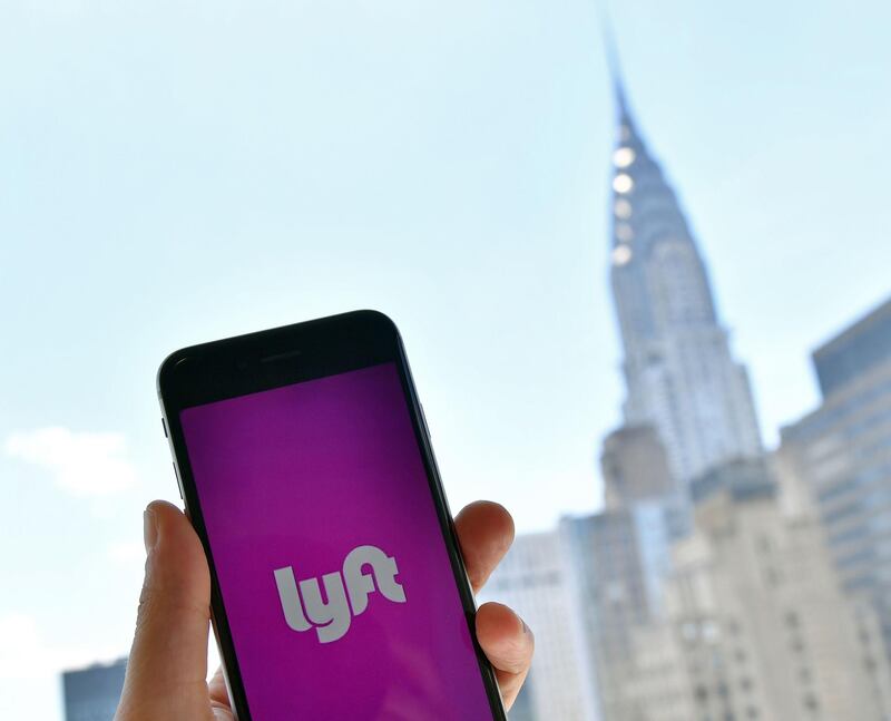 (FILES) In this file photo taken on June 29, 2018, the Lyft transport application is seen on a smart phone in New York City. Ride-hailing firm Lyft on December 6, 2018, launched the process to take the company public with a stock offering. However, Lyft -- whose main competitor Uber also wants to enter the stock market -- has not released any details on the initial sales price or the number of shares to be offered, since the document filed with regulators was confidential. / AFP / ANGELA WEISS
