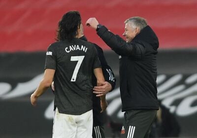 Soccer Football - Premier League - Southampton v Manchester United - St Mary's Stadium, Southampton, Britain - November 29, 2020 Manchester United's Edinson Cavani celebrates with manager Ole Gunnar Solskjaer Pool via REUTERS/Mike Hewitt EDITORIAL USE ONLY. No use with unauthorized audio, video, data, fixture lists, club/league logos or 'live' services. Online in-match use limited to 75 images, no video emulation. No use in betting, games or single club /league/player publications.  Please contact your account representative for further details.