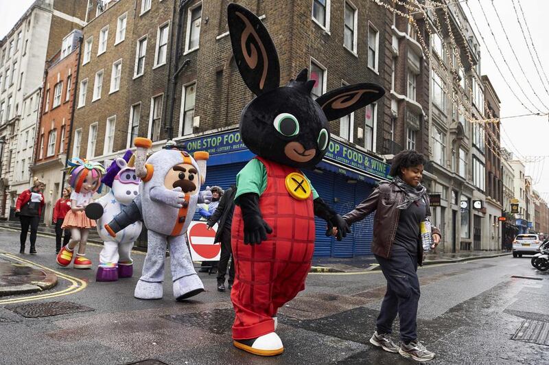 Performers dressed as children’s toy characters get ready to take part in the Hamleys Christmas Toy Parade in London. Niklas Halle’n / AFP Photo