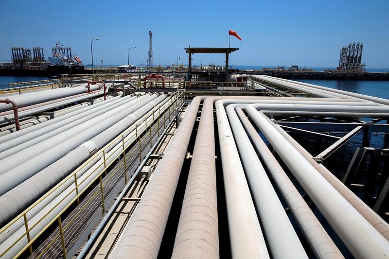 FILE PHOTO: An oil tanker is being loaded at Saudi Aramco's Ras Tanura oil refinery and oil terminal in Saudi Arabia May 21, 2018.REUTERS/Ahmed Jadallah/File Photo