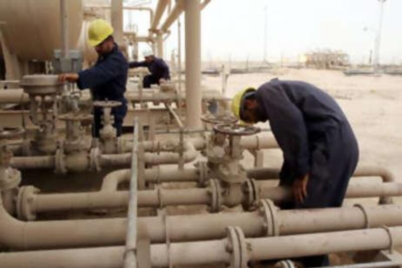 Employees work at the Zubair Moshrif oil field, 600 km southeast of Baghdad in Iraq.