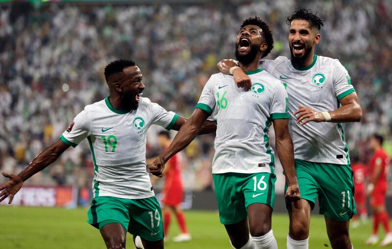 Saudi Arabia’s Sami Alnaji is greeted by teammates Saleh Khaled (R) and Fahd Mosaed (L) after scoring in the Asian zone group B qualifying match for the 2020 Fifa World Cup in Qatar. AP Photo