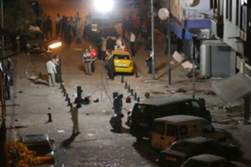 Forensic officers investigate the scene of the two bombs in a busy shopping district in Istanbul.