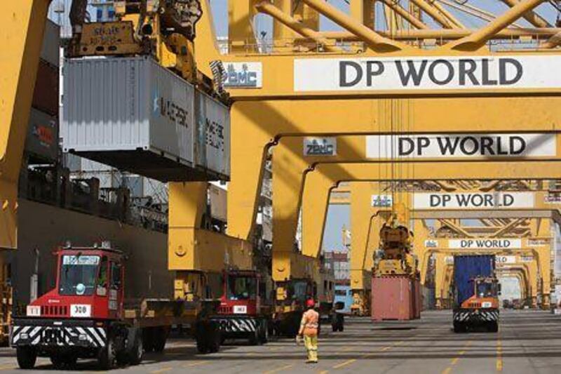 Cranes load containers at Jebel Ali port in Dubai. PMI results signal that the economy is managing to avoid a cooling off across other emerging markets. Pawan Singh / The National