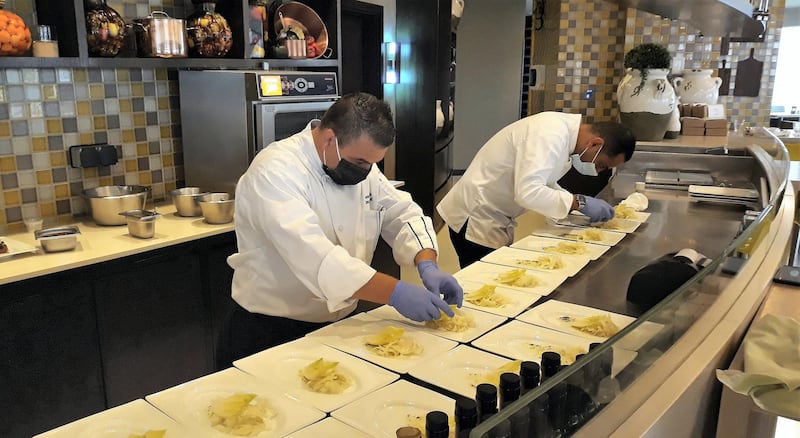 Chefs Munier Alsallaq and Murad Zayed cooking on World Olive Day at Amman Rotana Hotel. Photo: Nico Dingemans
