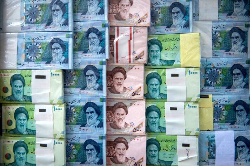 Iranian rial banknotes stand on display at a currency exchange in Tehran, Iran, on Saturday, May 18, 2019. President Donald Trump warned Iran not to threaten the U.S. or face ruinous consequences as tensions mount between Washington and Tehran. Photographer: Ali Mohammadi/Bloomberg via Getty Images