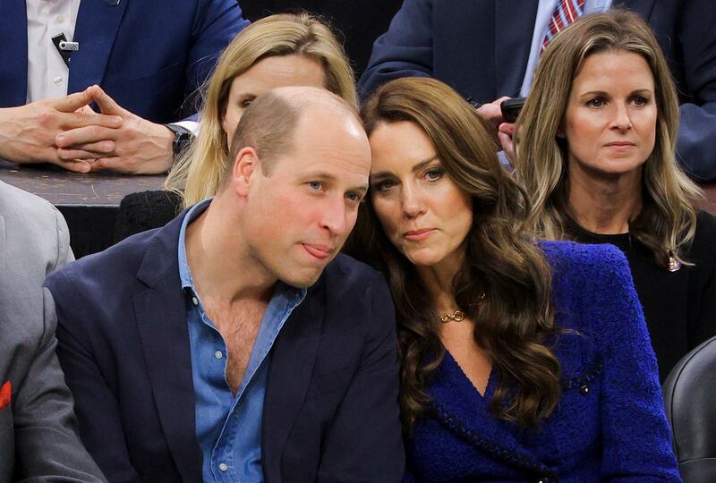 The Prince and Princess of Wales discuss the players' skills at the Boston Celtics game. EPA