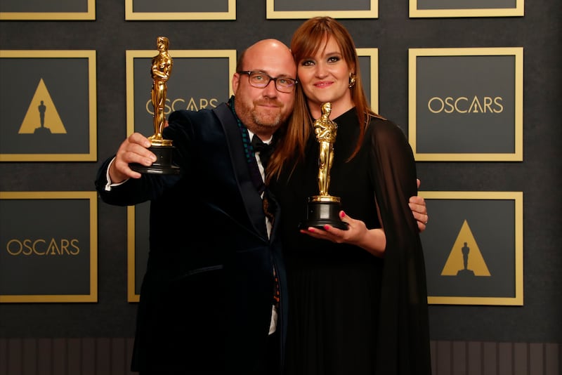 Patrice Vermette, left, and Zsuzsanna Sipos, winners of the Academy Award for Production Design for 'Dune', pose with their Oscar trophies in the press room. EPA