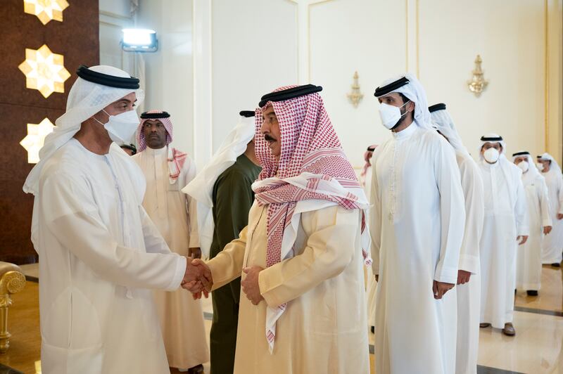 King Hamad of Bahrain, front right, and Sheikh Nasser bin Hamad, fifth from left, speak with Sheikh Hazza bin Zayed, Vice Chairman of Abu Dhabi Executive Council, left. Abdulla Al Neyadi for the Ministry of Presidential Affairs 