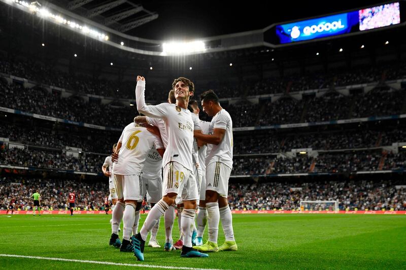 Real Madrid's Spanish defender Alvaro Odriozola and teammates celebrate their second goal scored by Real Madrid's Brazilian forward Rodrygo. AFP