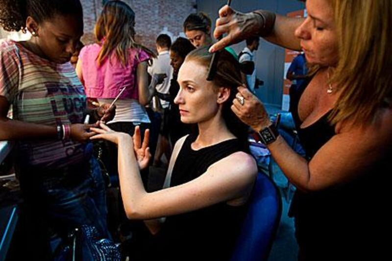 A model has her hair and nails done for the Andrea Marques show during Fashion Week in Rio de Janeiro on Saturday.