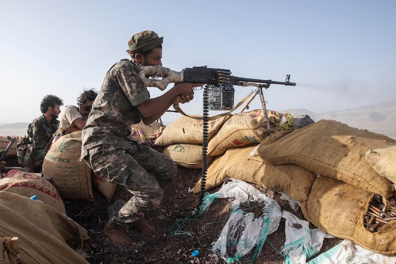 A Yemeni fighter backed by the Saudi-led coalition during clashes with Houthi rebels near Marib, western Yemen, in 2021. AP