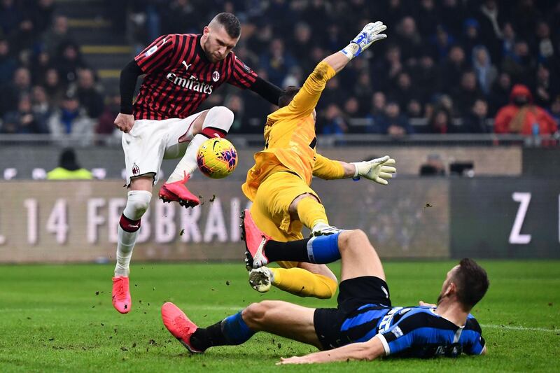 AC Milan forward Ante Rebic scores the opening goal at the San Siro. AFP