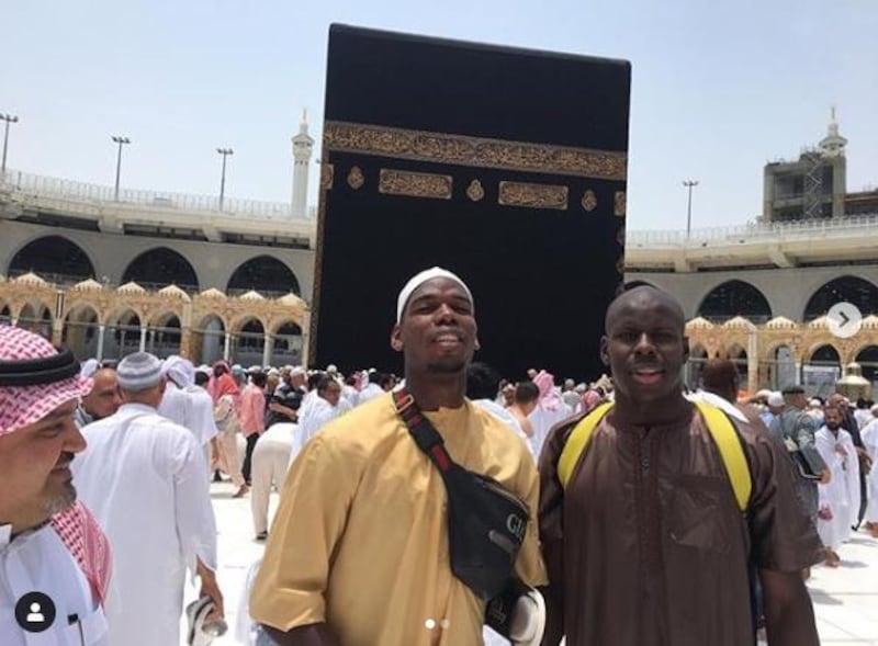 Manchester United's Paul Pogba and Chelsea's Kurt Zouma were pictured standing in front of the Kaaba at the Grand Mosque in Makkah, Saudi Arabia in May. Courtesy Paul Pogba / Instagram