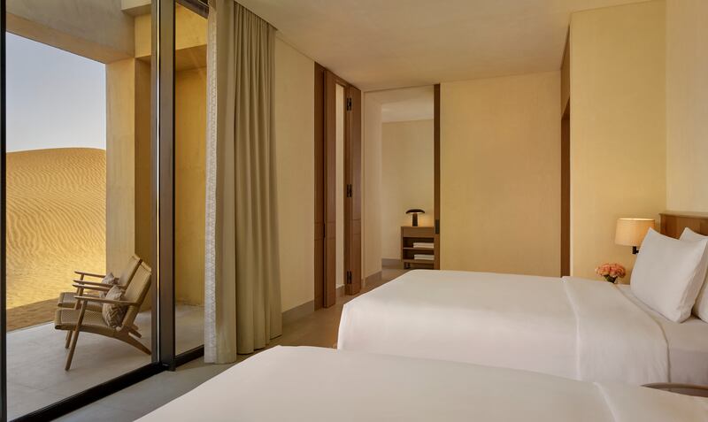 The twin bedroom also has a private balcony with direct access to the desert