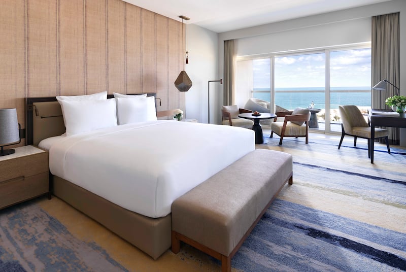 Rooms at the property overlook the Hajar mountains or the ocean.