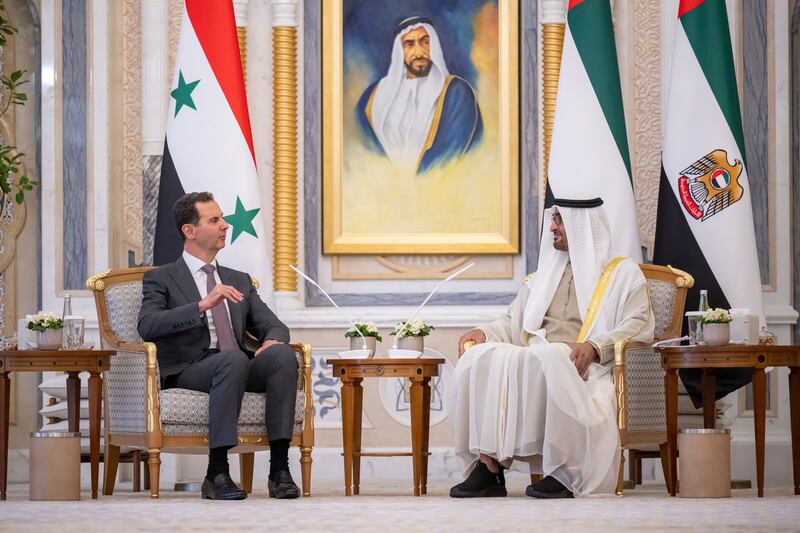 Sheikh Mohamed speaks with Mr Al Assad. Presidential Court