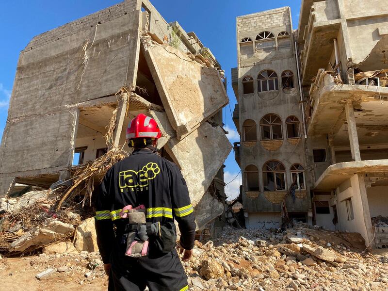 A Spanish rescue worker in Derna where authorities have been struggling to cope with thousands of flood victims' bodies washing up or decaying under rubble. Reuters