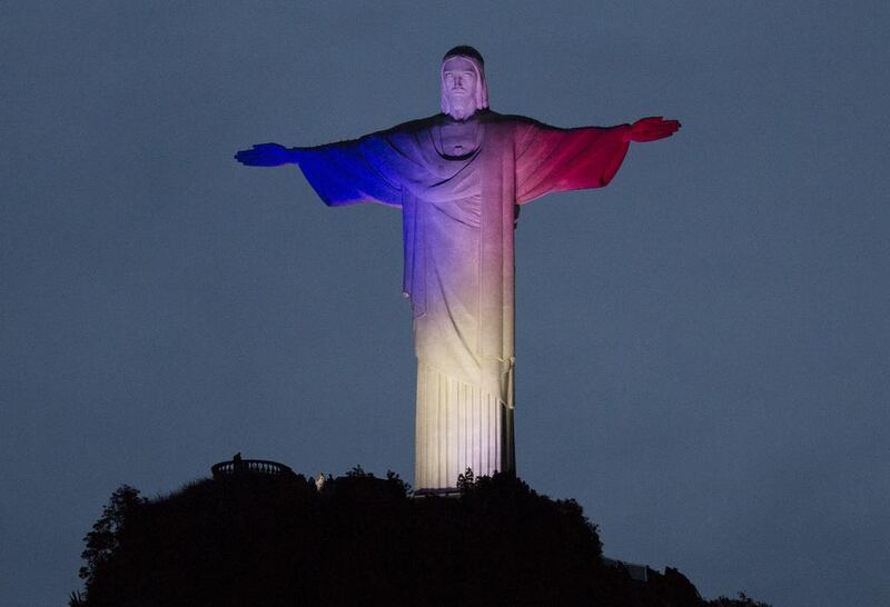 Christ the Redeemer statue in Rio de Janeiro, Brazil is lit with the colors of France's flag, in solidarity with France. Leo Correa/AP Photo