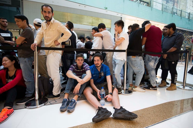 DUBAI, UNITED ARAB EMIRATES, 21 SEPTEMBER 2018 - Crowd at Iphone XS launch at Apple store Dubai Mall.  Leslie Pableo for The National