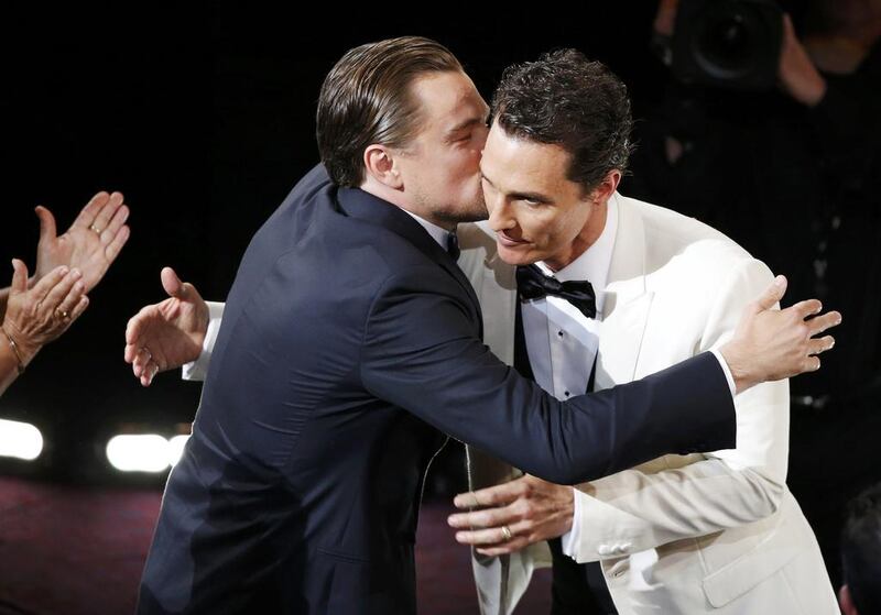 Matthew McConaughey, best actor winner for his role in Dallas Buyers Club, is congratulated by best actor nominee Leonardo DiCaprio, right. Lucy Nicholson / Reuters