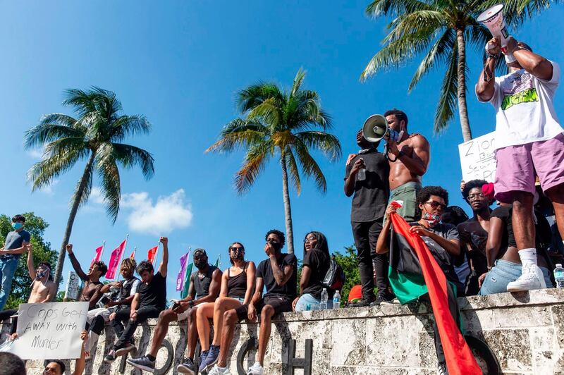 Protesters gather during a protest against police brutality in Miami, Florida.  AFP